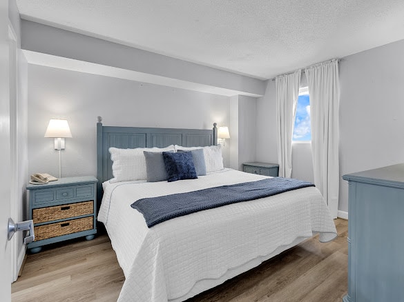 Bedroom with coastal blue furniture and ocean decor